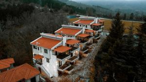 an aerial view of a large house with orange roofs at Villas Lirtzis in Taxiarchis