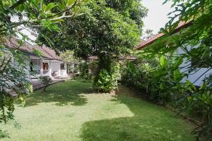 Zahrada ubytování Indopurejoy House - Komala Indah Cottages