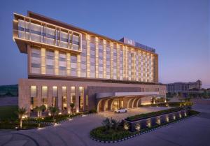 a building with a car parked in front of it at Taj Amer, Jaipur in Jaipur