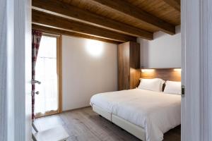 A bed or beds in a room at Residence Villa Brioschi
