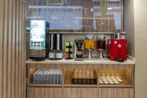 a coffee shop with a coffee machine on a shelf at The Omiya Hotel in Istanbul
