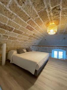 Una cama o camas en una habitación de La Finestra sul Teatro