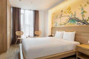 Ένα ή περισσότερα κρεβάτια σε δωμάτιο στο Jacayl Hotel TCG