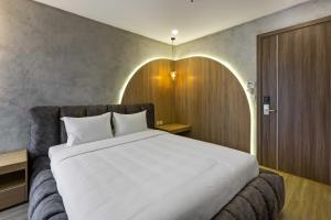 Ένα ή περισσότερα κρεβάτια σε δωμάτιο στο Jacayl Hotel TCG