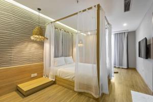Ένα ή περισσότερα κρεβάτια σε δωμάτιο στο Jacayl Hotel TCG