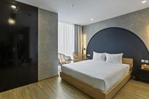 Ένα ή περισσότερα κρεβάτια σε δωμάτιο στο Jacayl Hotel TCG