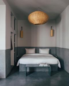 a bedroom with a large bed and a table at Riad no37 in Marrakech