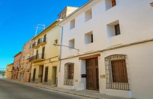 a row of buildings on a city street at Casa Bienvenida - La Fallera in Carcagente