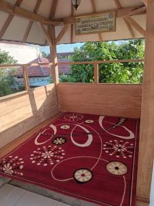 Giường trong phòng chung tại Asri Homestay Ponorogo