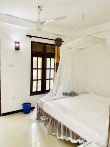 Letto o letti in una camera di Inu Vicky Beach Hotel
