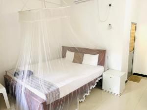 Letto o letti in una camera di Inu Vicky Beach Hotel
