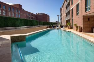 a large swimming pool in the middle of a building at The Limited Hotel in Charleston