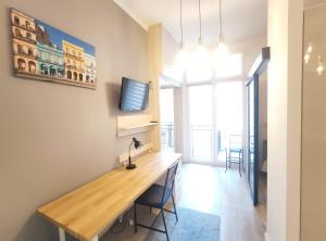 Televízia a/alebo spoločenská miestnosť v ubytovaní Starowiślna 43 (C) by Homeprime + 3 fotografie