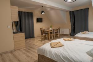 Posteľ alebo postele v izbe v ubytovaní Apartamenty Na Rozstaju