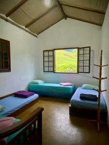 Postel nebo postele na pokoji v ubytování Casa Maia Sana Hostel