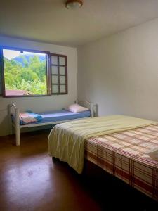 Casa Maia Sana Hostel客房内的一张或多张床位