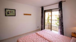 Postel nebo postele na pokoji v ubytování Primera línea Playa Cargador - Playamar 1122 - ALBERT VILLAS