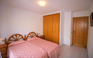 Postel nebo postele na pokoji v ubytování Primera línea Playa Cargador - Playamar 1122 - ALBERT VILLAS
