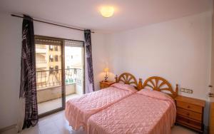 Postel nebo postele na pokoji v ubytování Primera línea Playa Cargador - Playamar 1122 - ALBERT VILLAS