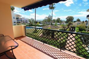 a balcony with a view of a city at Apartment 10 minutes walk from Puerto Banus in Marbella