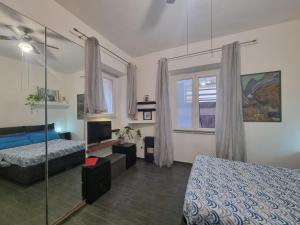 Postel nebo postele na pokoji v ubytování MareVestrum - incantevole casa con accesso diretto in spiaggia