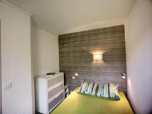 En eller flere senge i et værelse på Appartement Les Menuires, 2 pièces, 4 personnes - FR-1-178-48