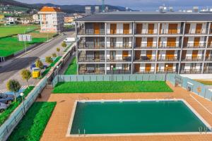 an overhead view of a building with a swimming pool at Apartagal-Playa de Llas, Foz in Foz