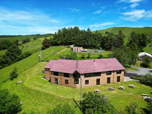 an aerial view of a large house on a hill at The Lodge in Llanbrynmair