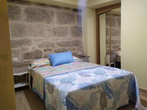 Ένα ή περισσότερα κρεβάτια σε δωμάτιο στο Casita Rural Puentesampaio