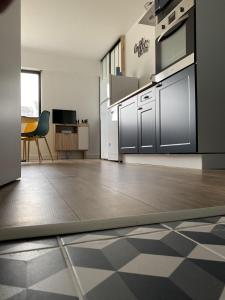 Kuchyňa alebo kuchynka v ubytovaní Super appartement cosy, parking privé + 10 fotografií