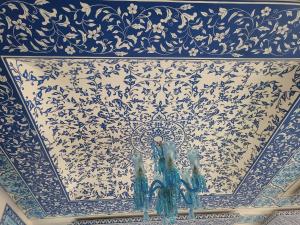 a blue and white wall with a blue and white pattern at All Seasons Homestay in Jaipur