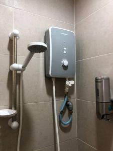 a phone on a wall in a bathroom at 1. Luxury Kristal condo 1 丹绒亚路市中心高級住宅 in Kota Kinabalu