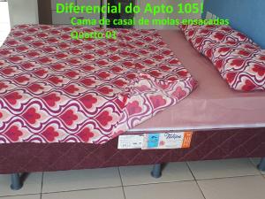 a bed with avertisement for at Apartamento a 60 metros para pé na areia - The Fountains - apto 105 in Beberibe