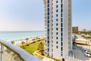 a view of a building and the beach at Sterling Sands 614 in Destin