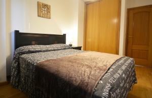 Postel nebo postele na pokoji v ubytování Céntrico apartamento con parking en O Grove