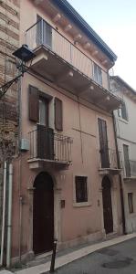 a building with two balconies on the side of it at L'Ultima Rosa in Verona