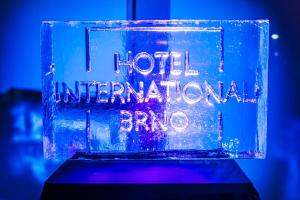 a glass block with the words i not international brick at Hotel International Brno in Brno