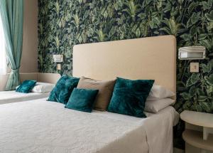 Postel nebo postele na pokoji v ubytování Hotel Maarea