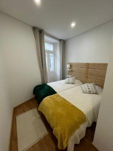 Postel nebo postele na pokoji v ubytování Down Bonjardim Apartments