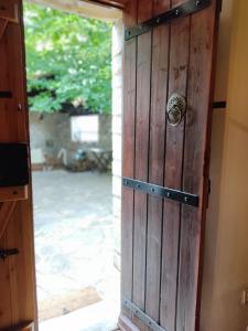 a wooden door with a door knob on it at Aronia Stone House in Lafkos