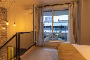 Łóżko lub łóżka w pokoju w obiekcie N23 Dwupoziomowy Apartament Łódź Centrum Wi-Fi Klimatyzacja