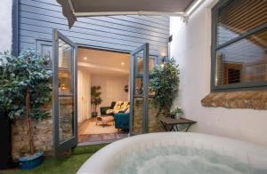 a hot tub in a backyard with a house at The Holgate Hideaway with Hot Tub in York