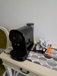 a coffee maker sitting on top of a table at Los Calaos de Briones in Briones