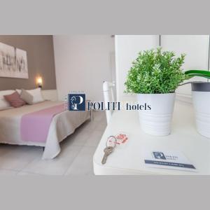 A bed or beds in a room at HOTEL CONTI