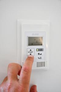 a hand is turning on a light switch at Roatel Schwabhausen A4 my-roatel-com in Schwabhausen