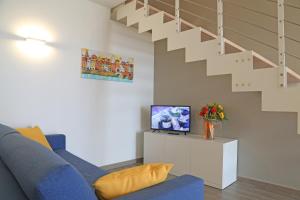 TV a/nebo společenská místnost v ubytování Appartamenti Bellavista