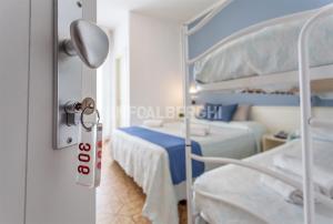 A bed or beds in a room at HOTEL CONTI
