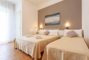 A bed or beds in a room at HOTEL CONTI