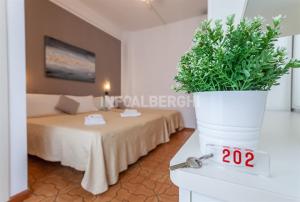 A bed or beds in a room at HOTEL CONTI