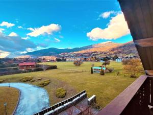 a view from the balcony of a house with a field at Appartement Samoëns, 2 pièces, 5 personnes - FR-1-624-41 in Samoëns